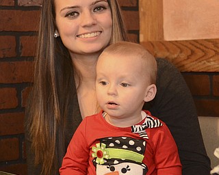 Katie Rickman | The Vindicator.Kerrigan McDermott, 17 of McDonald holds her 1-year-old daughter Isaballa Grace McDermott and discusses what its like to be a teen mom and also her Giving tree donation she started on Dec. 18, 2014.