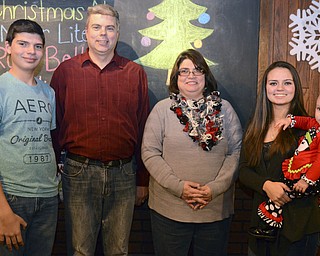 Katie Rickman | The Vindicator.The McDermott family L-R Bailey, 14, Leonard, Deanna, Kerrigan, 17, and her daughter Isabella, 1, all pose for a photo on Dec. 18, 2014.
