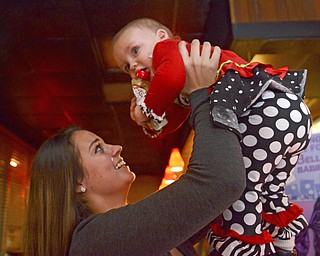 Katie Rickman | The Vindicator.Kerrigan McDermott, 17 of McDonald holds daughter Isabella Grace 1 and smiles on Thursday, Dec. 18, 2014.  Despite McDermott being a teenage mom she has worked really hard to provide for her daughter while excelling academically.  Recently she started a giving tree donation program to benefit the non profit organization in Warren that has helped her tremendously since she found out she was pregnant at 32 weeks.