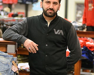 Katie Rickman | The Vindicator.Mehmet Kusini, owner of Toba (a clothing store) in Southern Park Mall, discusses the murder of his best friend Abdullah Mahdi earlier in the year on Dec. 18, 2014.