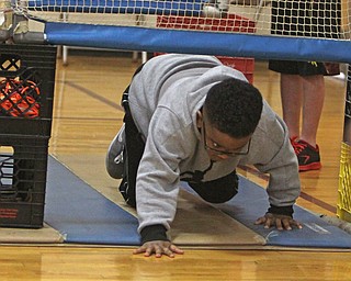 Brody Harden crawls through an obstacle course during Wllness Day at the W.S. Guy Middle School in Liberty on Wednesday morning.  Dustin Livesay  |  The Vindicator  12/17/14  Liberty.