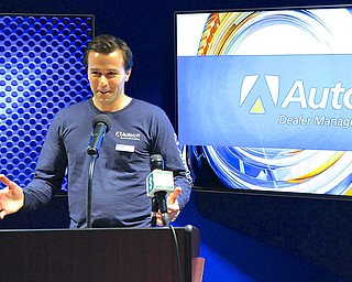 Jeff Lange | The Vindicator  President and CEO of Autosoft speaks about his company during a media conference at their newly renovated technology center in West Middlesex, PA, Wednesday afternoon.