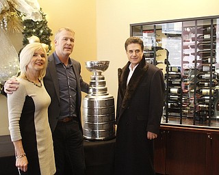       ROBERT K. YOSAY  | THE VINDICATOR..The Stanley Cup will be on display for photos in connection to its display at Friday night’s Phantoms game.Troy Loney and his wife Aafke  Loney with THE CUP  and Bruce Zoldan..-30-