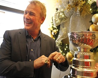        ROBERT K. YOSAY  | THE VINDICATOR..The Stanley Cup will be on display for photos in connection to its display at Friday night’s Phantoms game.Troy Loney points to the TWO rings he won and his name on the cup Twice.-30-