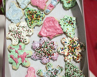        ROBERT K. YOSAY  | THE VINDICATOR..St. Christine students ( 4th grade )  decorate holiday cookies that will be donated to YoungstownÕs Dorothy Day House, which provides emergency shelter and a meal to people down on their luck....-30-