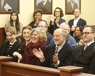        ROBERT K. YOSAY  | THE VINDICATOR...THe honorable Cheryl Waite...presided over the swearing in  of  Michele Hagan LePore  with her husband Robert Hagan and son Jimmie - and Daughter Natalia .....crowd of onlookers .