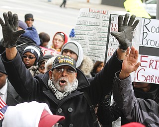        ROBERT K. YOSAY  | THE VINDICATOR..Hands UP is Bob Thorton ..A peace march took place protesting police actions in cases surrounding the deaths of Michael Brown, Michael Garner, Tamir Rice, and others across the country from the Federal Courthouse on Commerce and WIck to City Hall to Mahoning County Courthouse .