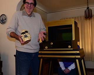 YOUNGSTOWN, OHIO - DECEMBER 22, 2014: Autograph collector and magician David Powers performs a illusion with his assistant Stacey McLain of Youngstown Monday afternoon at his Youngstown home. (Photo by David Dermer/Youngstown Vindicator)