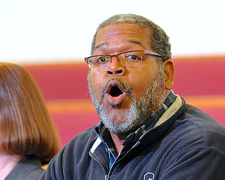 Jeff Lange | The Vindicator  William Blake of the YSU Office of Student Diversity Programs answers a question about race in Youngstown during Monday evening's community forum at Union Baptist Church.