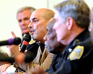 Jeff Lange | The Vindicator  Pastor Al Yanno of Metro Assembly Church of God (center) answers a question asked by a member of the audience during Monday evening's community forum at Union Baptist Church.