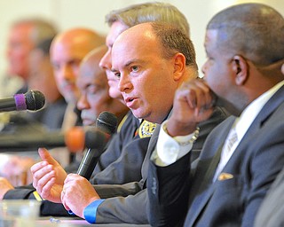 Jeff Lange | The Vindicator  Youngstown mayor John McNally (center) speaks on racial issues in the Youngstown area and how they can be handled, Monday evening at Union Baptist Church during a community forum.