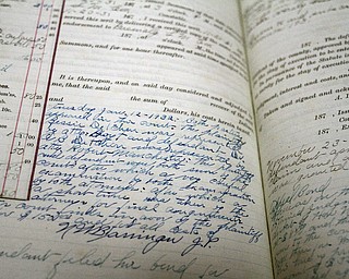        ROBERT K. YOSAY  | THE VINDICATOR..a hand written journal entry for a court case - dating back to 1932..in the township records on the second floor of  the Twp Building in the center of Canfield ..-30-