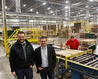        ROBERT K. YOSAY  | THE VINDICATOR..Millwood Natural, the premiere local supplier of environmental containment products to the Marcellus and Utica shale industry, is expanding to meet the demands of the ever-growing oil and gas industry. - in Vienna ...ben Timmons and John.....- near the final inspection line as pallets are fixed and repaired.