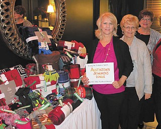 SPECIAL TO THE VINDICATOR
The Austintown Junior Women’s League recently had its annual Christmas party at the Upstairs Restaurant. Members collected hats, gloves and blankets to donate to those in need at the Rescue Mission of Mahoning Valley. Above, from left, are Mary Toporcer, event chairwoman; Nancy Jones; Kathy Rusback; and Janice Simmerman.