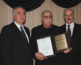 SPECIAL TO THE VINDICATOR
Polyvios Pavlidis was named honorary supreme lodge president at the 87th National Convention of the Pan-Rhodian Society of America in October in Hartford, Conn. The award was presented at the local lodge’s annual Christmas party Dec. 14 at DiLucia’s Banquet & Catering in Warren. Pavlidis lives in Berlin Center with his wife, Joann, and is the owner of Jo An Linen Co. Inc. They have three children and several grandchildren. Above, from left, are Christos Kotiadis, speaker; Ilias Tomazos, speaker; Pavlidis; Steve Pelardis of New Jersey, supreme president; and Vasilios Angelis of Warren, supreme secretary and speaker.