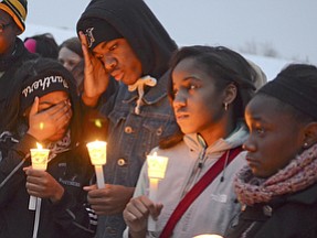 Katie Rickman | The Vindicator.L-R.Savannah Sockwell, 17, Taeshauna Moore, 16, Clemont Fowler, 17, Laynziah Johnson 16, and Precious Boone, 17  stand together at the vigil for Faith McCullough Wooster on Wed. November 19, 2014.