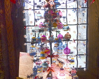 Katie Rickman | The Vindicator.Christmas decorations from the 1900's on display at the Arms Family Museum's Memories of Christmas Past display on Sunday afternoon.