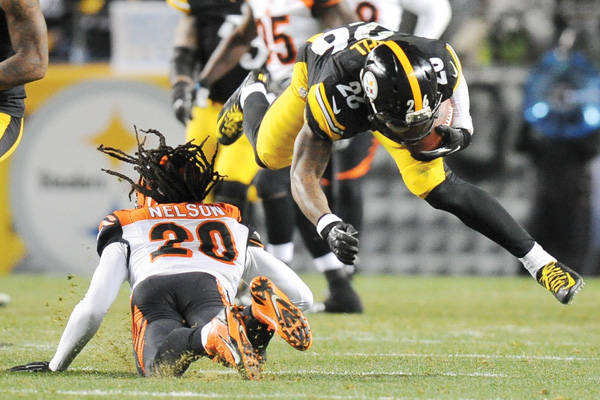 Steelers RB Le’Veon Bell is injured after being upended by Bengals FS Reggie Nelson in the third quarter of Sunday’s game at Heinz Field in Pittsburgh. The Steelers downed the Bengals, 27-17, to win the AFC North and earn a playoff berth.