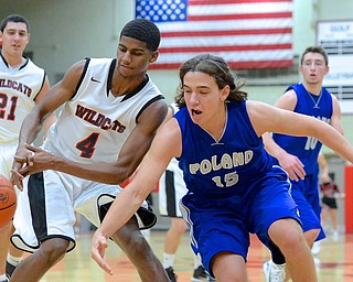 Jeff Lange | The Vindicator  Struthers' Ray Phifer (4) and Poland's Nick Buccieri (15) both reach out for the ball during fourth quarter action at Struthers High School, Tuesday night.