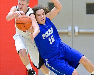 Jeff Lange | The Vindicator  Poland's Nick Buccieri (15) attempts to steal the ball away from Struthers' John Sefcik in the second period of Tuesday night's game in Struthers. Poland went on to beat Struthers 62-42.