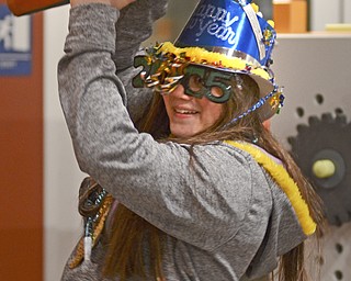 Katie Rickman | The Vindicator.Kamryn Flesher, 13 of Struthers catches a collapsing cushion from a tower as she shows off her New Years Eve glasses and hat at OH WOW! during First Night Youngstown.
