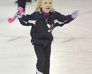 Katie Rickman | The Vindicator.Gwen McFarland of New Castle, PA skates off the ice at the Covelli Centre while sporting her New Years Eve part hat.  McFarland and many others enjoyed the skate during the First Night Youngstown event.