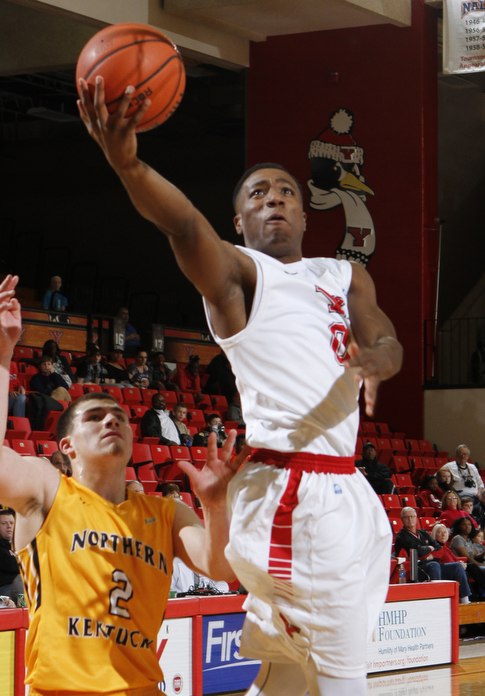 Youngstown State's Shaun Stewart (0) goes in for a layup past the defense by Northern Kentucky's Tayler Persons (2) during the second half of Wednesday afternoons matchup at the Beeghly Center.  Dustin Livesay  |  The Vindicator  12/31/14  Beeghly Center.