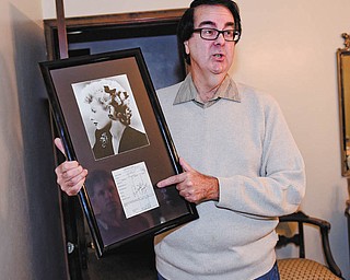 David Dermer | The Vindicator — Autograph collector David Powers shows off a Lucille Ball autograph at his Youngstown home.