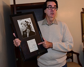 David Dermer | The Vindicator — Autograph collector David Powers shows off a Lucille Ball autograph at his Youngstown home.
