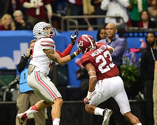 NEW ORLEANS, LOUISIANA - JANUARY 1, 2015: Devin Smith #9 of Ohio State prepares to catch a pass after getting behind Jabriel Washington #23 of Alabama during the 1st quarter of Thursday nights game at the Superdome. (Photo by David Dermer/Youngstown Vindicator)