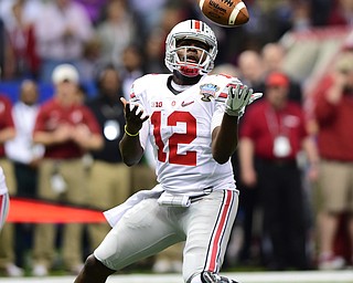 NEW ORLEANS, LOUISIANA - JANUARY 1, 2015: Cardale Jones #12 of Ohio State bobbles the snap on first and goal, the play would result in a loss of 8 yards during the 1st quarter of Thursday nights game at the Superdome. (Photo by David Dermer/Youngstown Vindicator)