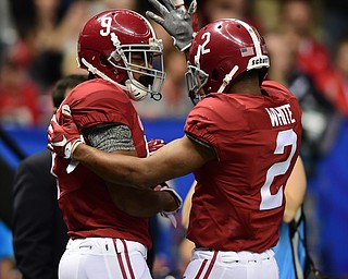 NEW ORLEANS, LOUISIANA - JANUARY 1, 2015: Amari Cooper #9 of Alabama celebrates with teammate DeAndrew White #2 after a first quarter touchdown during the 1st quarter of Thursday nights game at the Superdome. (Photo by David Dermer/Youngstown Vindicator)