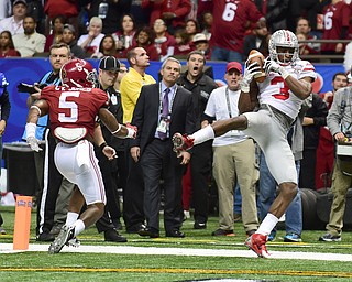 NEW ORLEANS, LOUISIANA - JANUARY 1, 2015: Michael Thomas #3 of Ohio State touches his foot down in the end zone to score a touchdown on a double reverse pass during the 2nd quarter of Thursday nights game at the Superdome. (Photo by David Dermer/Youngstown Vindicator) Cyrus Jones #5 of Alabama pictured.