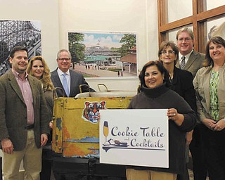 SPECIAL TO THE VINDICATOR — Staff of the Mahoning Valley Historical Society and members of the Young Leaders Advisory Board make plans for the third annual Cookie Table and Cocktails fundraiser. From left to right are Frank Rulli, event chairman; Erica Shonn; Scott Zoldan, MVHS board member and first vice president of The Waypoint Group title sponsor; Leslie Limbian; Cheryl Lewis, campaign director, Bill Lawson, executive director; and Leann Rich, manager of education and external relations.