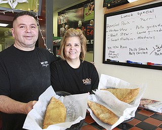 William D Lewis The Vindicator Carmello and Jeanette Morales, ownersof .Papa's. Popular eatery is now located on Belmont Ave in Liberty.