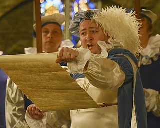 Katie Rickman | The Vindicator.Michael Black sings while playing the part of the Herald during the 54th annual Boar's Head & Yule Log Festival at St. John's Episcopal Church on Sunday, Jan. 4, 2014.