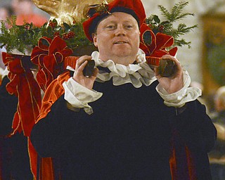 Katie Rickman | The Vindicator.Jason Lisko carries the boars head in with the help of Walt Baver during the 54th annual Boar's Head & Yule Log Festival at St. John's Episcopal Church on Sunday, Jan. 4, 2014.