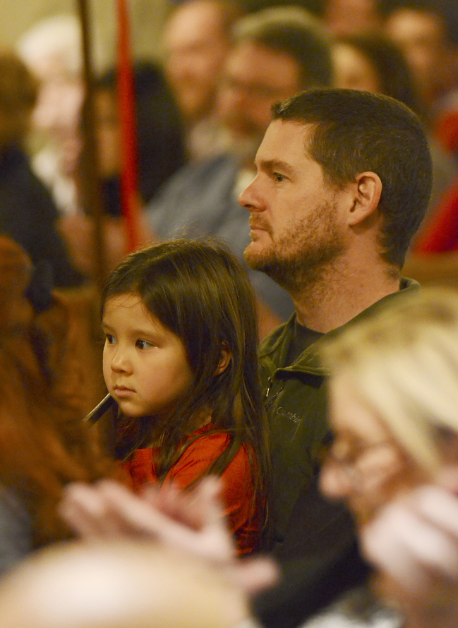 Katie Rickman | The Vindicator.Matt Shears of Berkeley, California holds his daughter 6-year-old daughter Amelie during the 54th annual Boar's Head & Yule Log Festival at St. John's Episcopal Church on Sunday, Jan. 4, 2014.