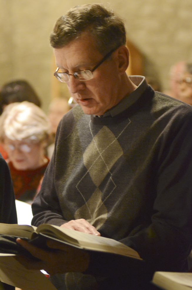 Katie Rickman | The Vindicator.Donald Rota of Girard sings a song from a hymnal during the 54th annual Boar's Head & Yule Log Festival at St. John's Episcopal Church on Sunday, Jan. 4, 2014.