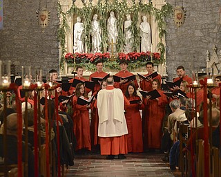 Katie Rickman | The Vindicator.A choir performs during the 54th annual Boar's Head & Yule Log Fesitval at St. John's Episcopal Church on Sunday, Jan. 4, 2014.
