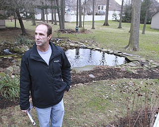 William d Lewis the vindicator  Dave Carelli stands in the backyard of his home @ 3712 Tippecanoe Pl. in Canfield. He is complaining about water problems.
