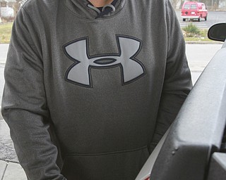 William D. Lewis The Vindicator Damon Petrich of Boardman is all smiles as he fills up at Shell on Market St in Youngstown,  12/29/14.