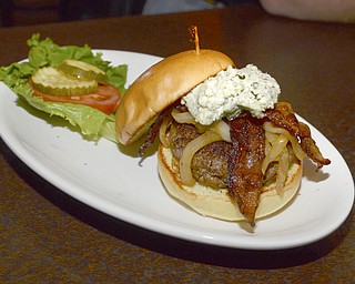 Katie Rickman | The Vindicator.J.T. Tranovich's burger choice of the evening was the Black & Blue Burger which features applewood smoked bacon,  caramelized onions, blue cheese, and grilled brioche and runs for $10.