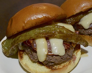 Katie Rickman | The Vindicator.The Italian Burger is one of the specialty burgers offered occasionally at V2, it features capicola cheese, aged provolone cheese, and fried hungarian papers