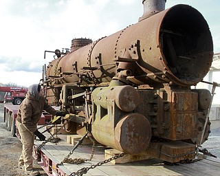 William D. Lewis The Vindicator Rick Rowlands of the Youngstown Steel Heritage Museum inspects a  1937 narrow gauge steam locomotive that was used in the Pittsburgh industry. The locomotive was moved from Middlefield Oh, 12-30-14 to the Youngstown Steel Heritage Museum on Hubbard Rd where it will be restored.