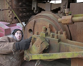 William D. Lewis The Vindicator Rick Rowlands of the Youngstown Steel Heritage Museum inspects a  1937 narrow gauge steam locomotive that was used in the Pittsburgh industry. The locomotive was moved from Middlefield Oh, 12-30-14 to the Youngstown Steel Heritage Museum on Hubbard Rd where it will be restored.