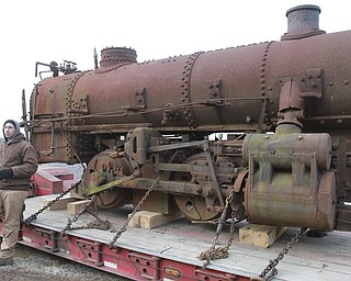 William D. Lewis The Vindicator Rick Rowlands of the Youngstown Steel Heritage Museum inspects a  1937 narrow gauge steam locomotive that was used in the Pittsburgh industry. The locomotive was moved from Middlefield Oh, 12-30-14 to the Youngstown Steel Heritage Museum on Hubbard Rd where it will be restored.