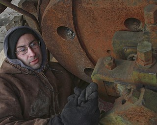 William D. Lewis The Vindicator Rick Rowlands of the Youngstown Steel Heritage Museum inspects a  1937 narrow gauge steam locomotive that was used in the Pittsburgh industry. The locomotive was moved from Middlefield Oh, 12-30-14 to the Youngstown Steel Heritage Museum on Hubbard Rd where it will be restored.