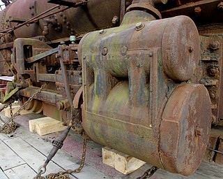 William D. Lewis The Vindicator Rick Rowlands of the Youngstown Steel Heritage Museum inspects a  1937 narrow gauge steam locomotive that was used in the Pittsburgh industry. The locomotive was moved from Middlefield Oh, 12-30-14 to the Youngstown Steel Heritage Museum on Hubbard Rd where it will be restored.
