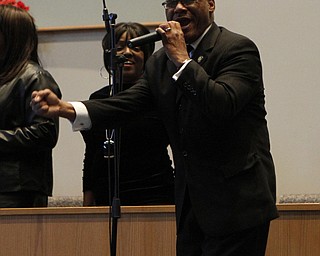 Pastor Ernest Ellis leads the choir in a song during the Emancipation Proclamation and Installment service at the New Bethel Baptist Church in Youngstown on Thursday morning.  Dustin Livesay  |  The Vindicator  1/1/15  Youngstown, Ohio.